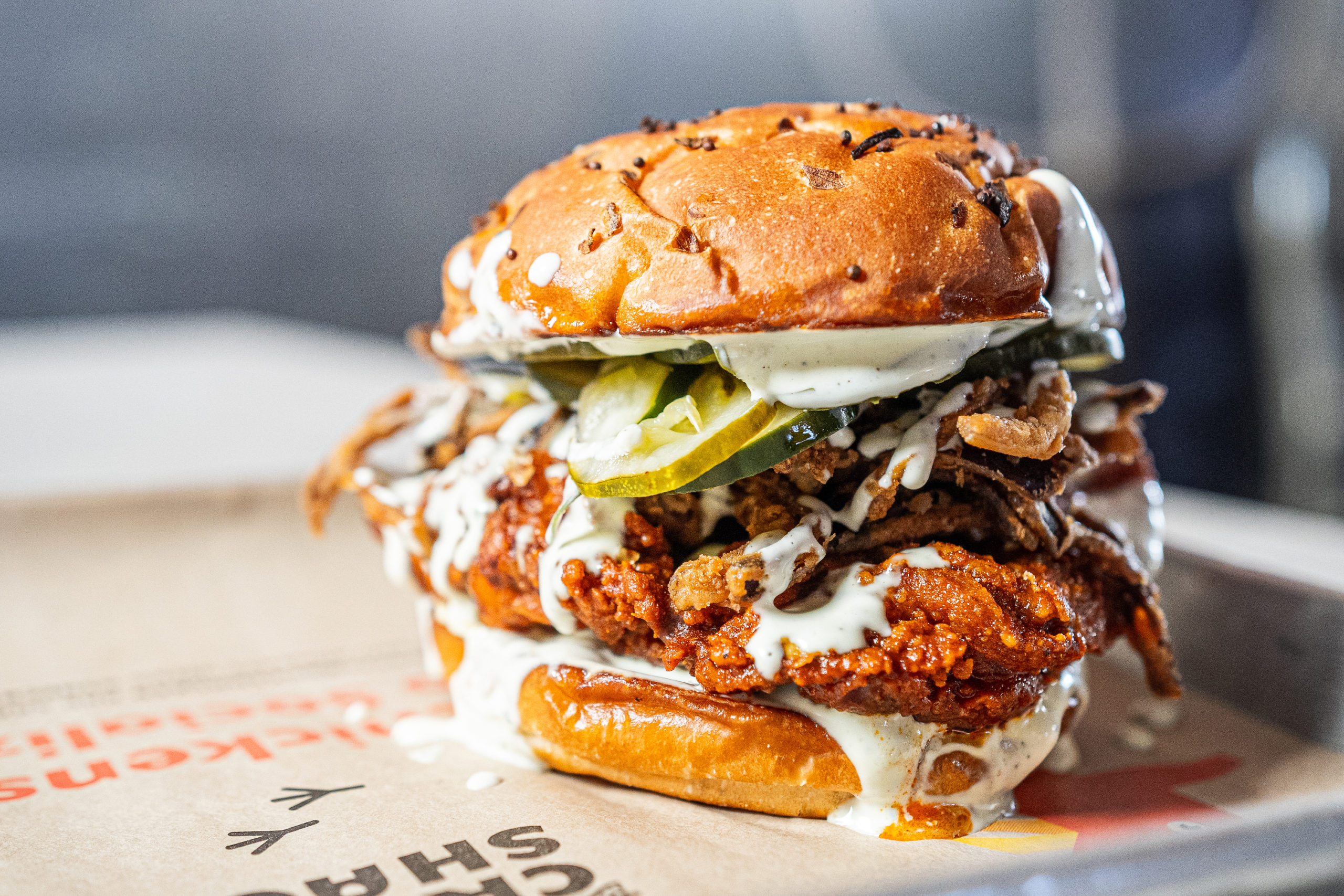 Spicy fried chicken sandwich on a tray