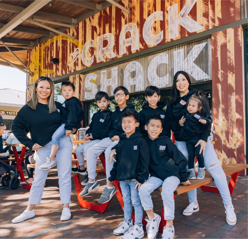 big family in front of crack shack location